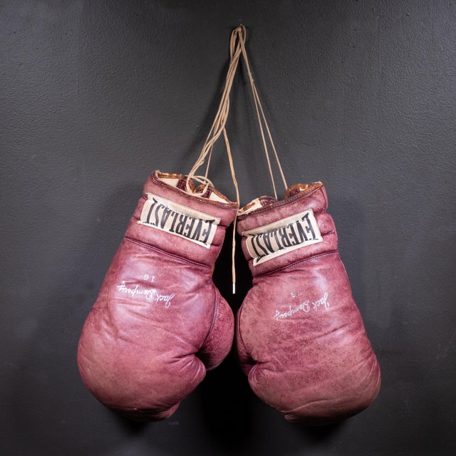ABOUT An original pair of thick Everlast brown leather boxing gloves stuffed with horse hair. Large "Everlast" tag and...