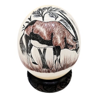 Mid-Century South African Scrimshaw Ostrich Egg With Engraved Oryx on Carved Wood Stand For Sale