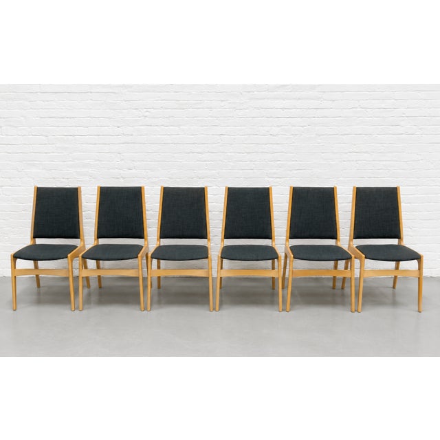 Set of six Danish Mid Century Modern dining chairs, crafted in Denmark circa 1960s. These chairs feature elegantly...