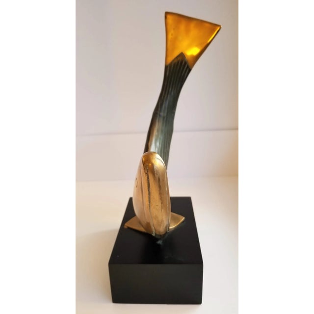 Dolbi Cashier brass whale sculpture. Great proportion and lines. This is nice sculpture mounted on a base. I am not sure...