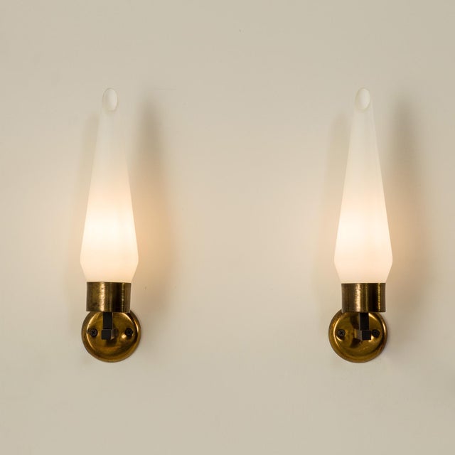 This pair of elegant mid-century wall lights was made in italy in the 1960s. Due to the quality of manufacture and...