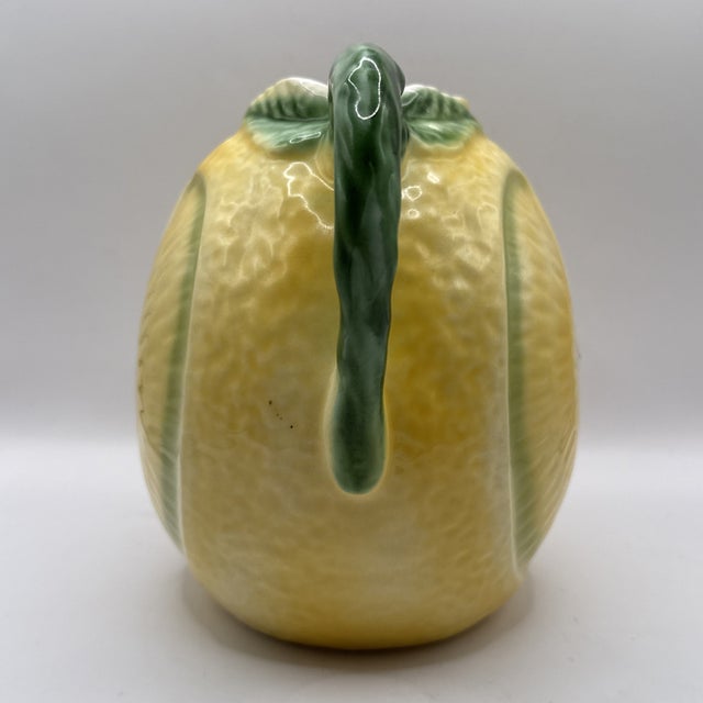 Bring a touch of Mediterranean charm to your home with this **Vintage Ceramic Lemon Shaped Pitcher**, beautifully crafted...