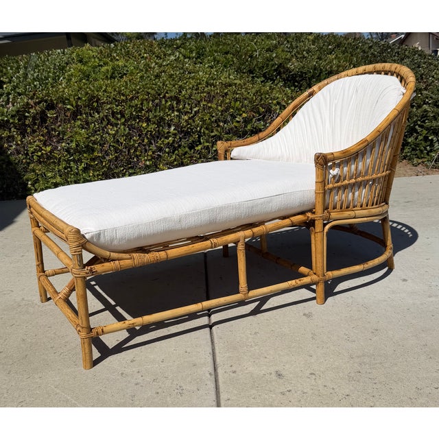 Beautiful RARE vintage chaise lounge! Crafted of rattan & stick reed with a graceful rounded back and stick wicker...