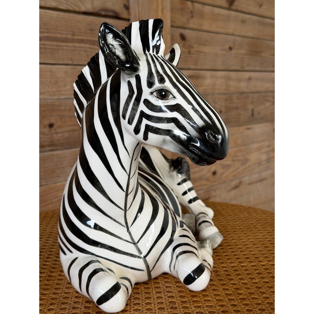 A striking large-scale vintage ceramic zebra figurine by Tilso Japan, beautifully executed with bold hand-painted black...