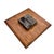A distinctive vintage wall sculpture featuring an abstract ceramic fish relief mounted on a substantial wood panel. The...