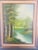 An oil on canvas landscape painting featuring a peaceful scene of a river in the middle of the wood. The painting is made...