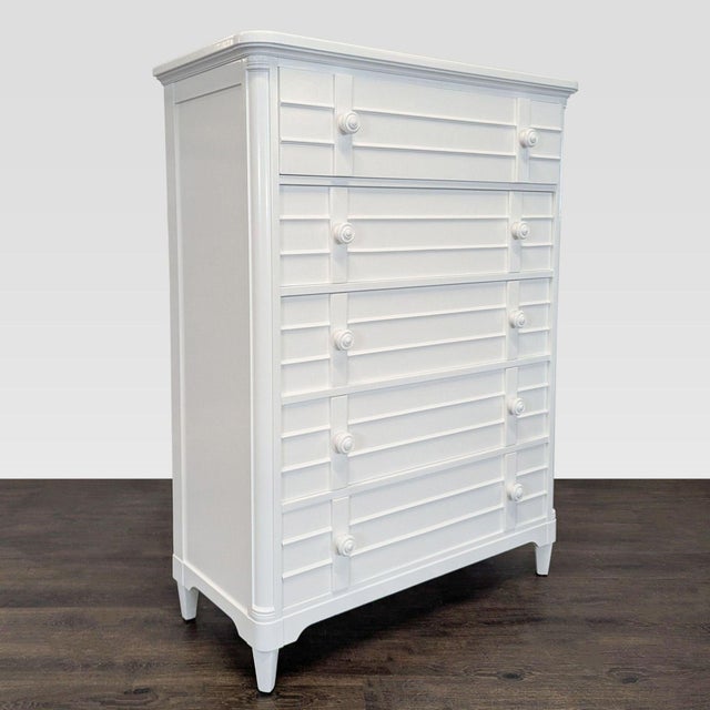 This dresser by Stanley Furniture features a clean white finish and a modern look with classic details. It has five...