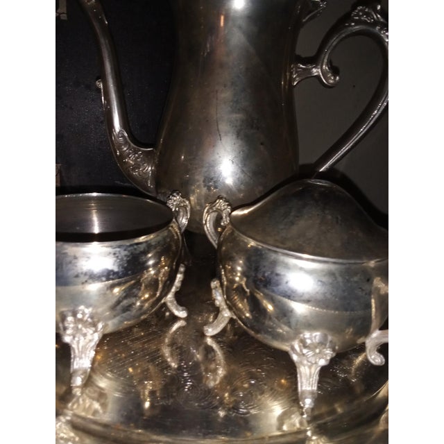 This is a early 19th century he said it is silver plated it does have a floral pattern.