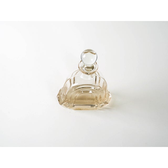 The carafe was made in the 1970s in Italy. A decorative carafe with a streamlined, sculptural form, made of thick, moulded...