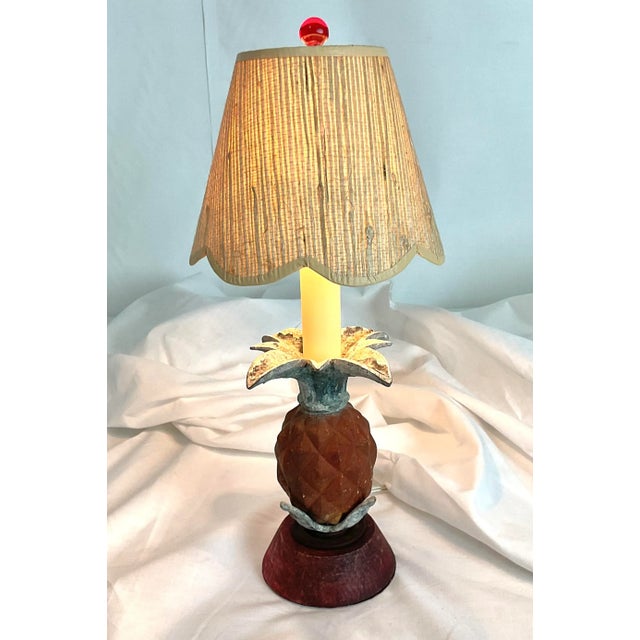 Add a touch of tropical charm to your space with this delightful vintage pineapple table lamp. Featuring a carved...