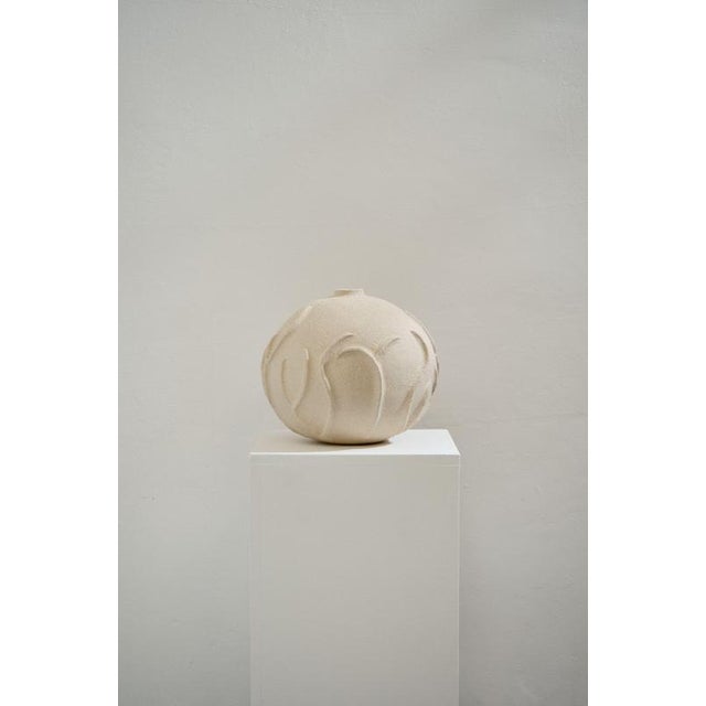 L´Algue Beige Sandstone Vase by Lou Thomas Dimensions: ⌀ 28 x H 28 cm Materials: Beige sandstone "Drawing on her extensive...