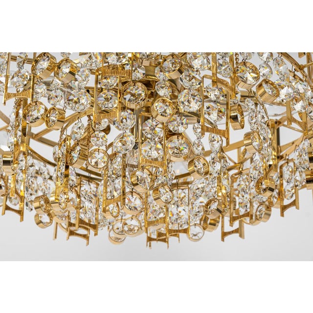 A wonderful and high quality gilded chandelier or pendant light fixture by palwa, germany, 1970s. It is made of a 24-carat...