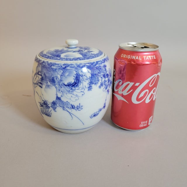 This antique Japanese blue and white porcelain mizusashi dates to the Meiji period (1868-1912) and was made for use in the...
