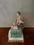 This is an antique Meissen figurine. It depicts “sight” of the “Five Senses” series. It is an elegant porcelain figure. It...