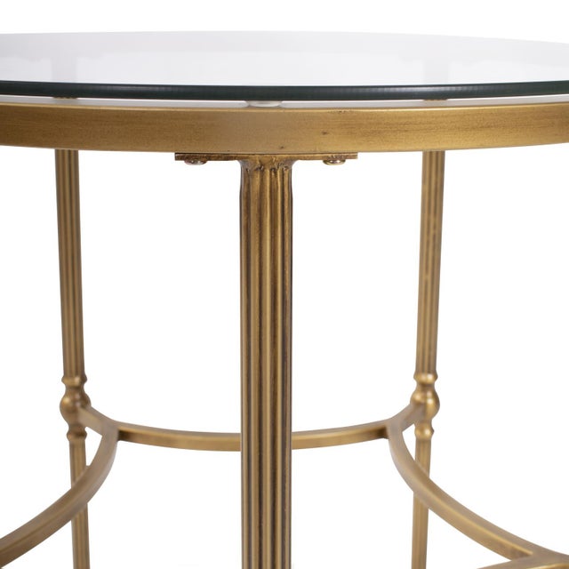 The detailed legs in antique bronze finish exude classic elegance. The glass top not only offers a sleek surface but also...