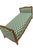A sculptural carved wood daybed with beautifully shaped ends and a long, elegant silhouette. Green-and-ivory patterned...