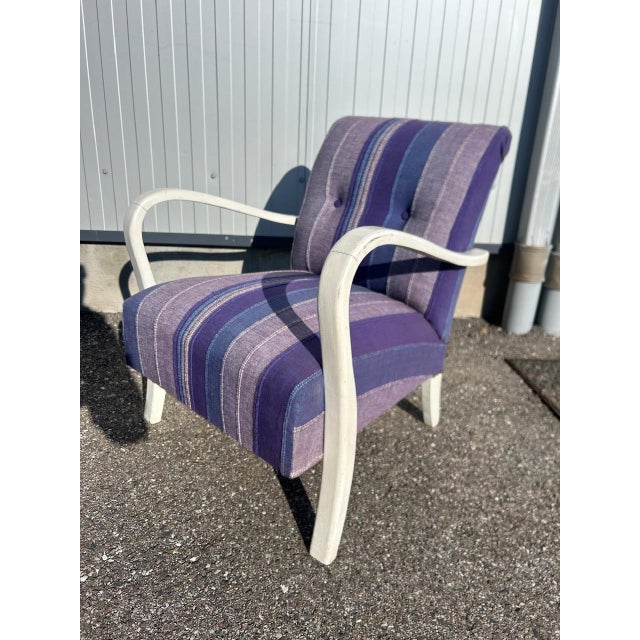 Pair of 1930s club chairs, reupholstered, armrests repainted later (stained)