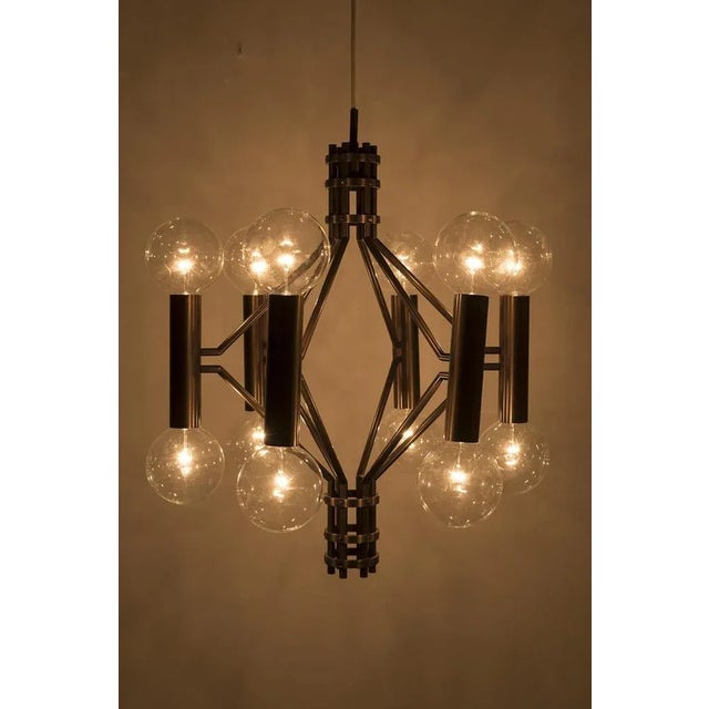 Wonderful brutistic bronze-colored hanging lamp in a beautiful art-deco style. Excluding Lightbulbs. Has some traces of...