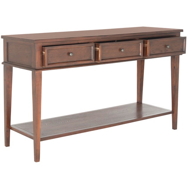 Simple lines and purity of function lend a timeless quality to the Shaker-inspired console with tapered legs, three...