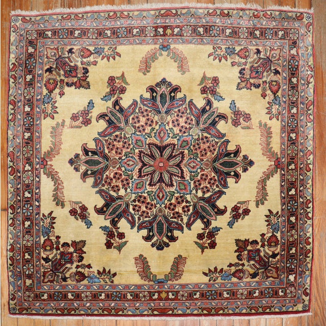An authentic early 20th-century small square size ornate Sarouk carpet with traditional formal design in rare square size....