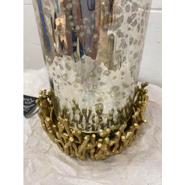 13"H X 7"D A silvered glass shade is surrounded in hand cast brass twigs adding depth and dimension making this is a truly...
