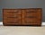 A rare mid century modern walnut six drawer dresser designed by T.H. Robsjohn Gibbings for Widdicomb with wooden and...