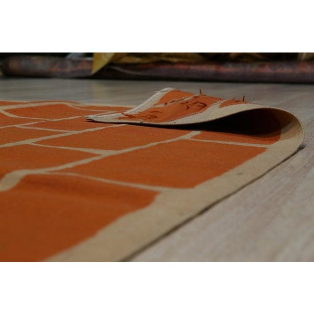 This yellow, gold, and orange wool rug features a flat weave construction in the style of traditional Kilims. Produced in...