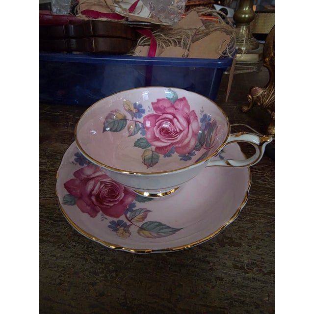 Beautiful pink teacup and saucer with rose design.