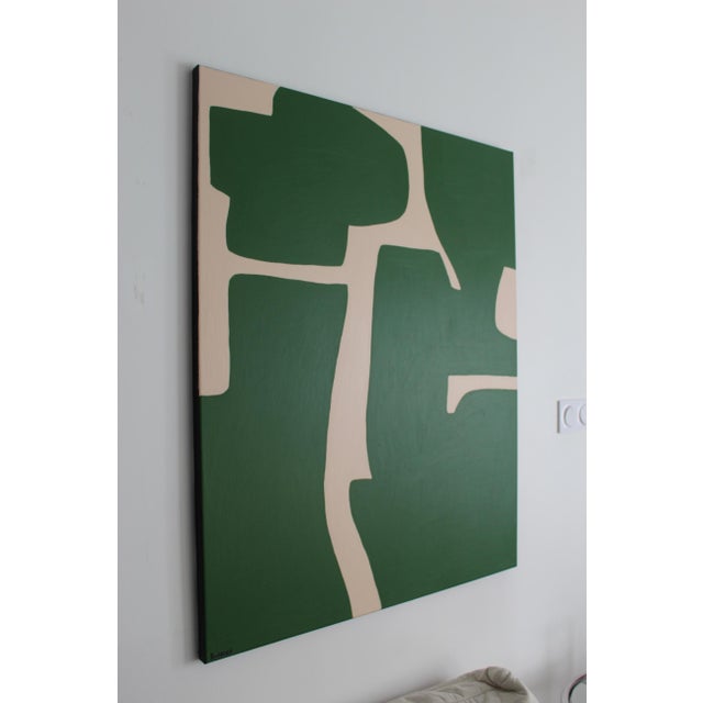 Discover "Organic Green Abstract 2." Green shapes stand out against a soft, light beige background, creating a natural and...