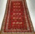This authentic vintage Turkmen area rug from Central Asia, handwoven with precision in the second quarter of the 20th...
