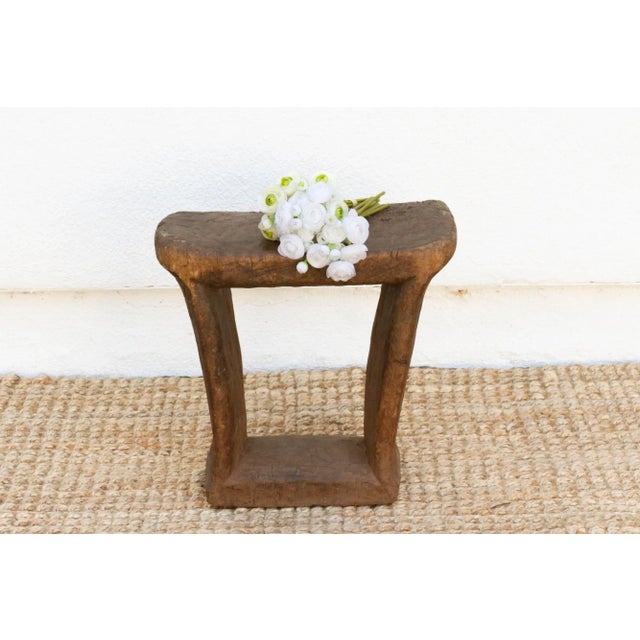 A piece of history, this antique wooden stool is from the Dogon tribe of Mali. This simple, semi abstract stool was used...