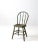 This is an antique painted bow back Windsor chair. The warm and textured farmhouse dining chair, with its distressed green...