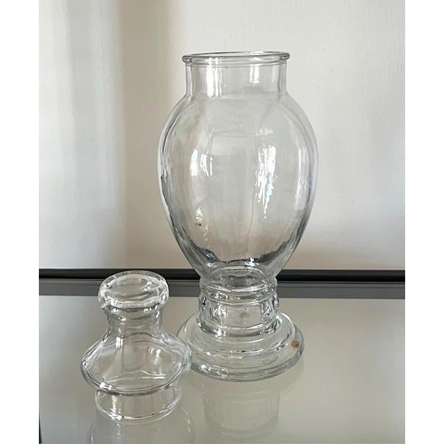 Vintage 10" high clear glass apothecary/candy/decorative jar. The glass of the body of the jar appears wavy rather than...