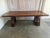 An impressive and richly detailed Spanish Colonial Revival dining table crafted from solid walnut, featuring a substantial...