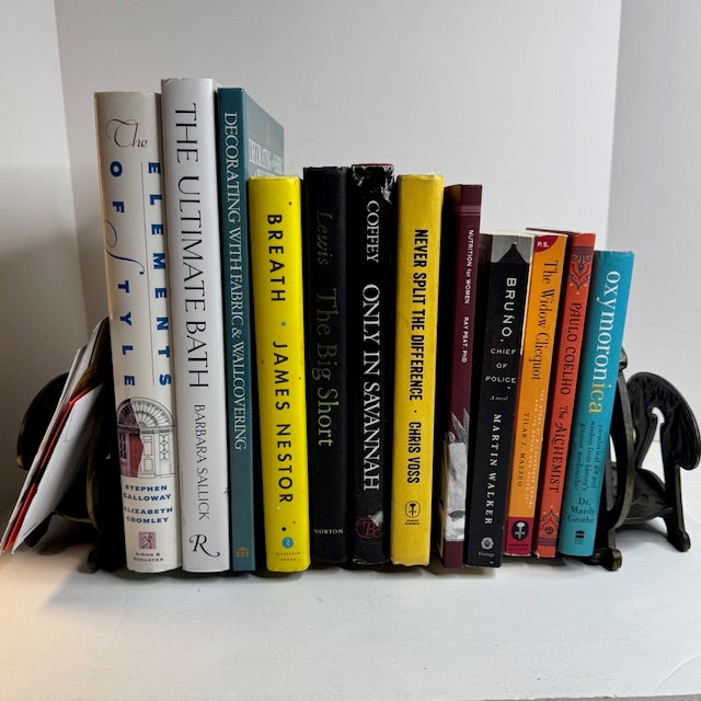 A beautifully cast Art Nouveau expandable book rack, featuring elegant figural maiden motifs and flowing organic lines...