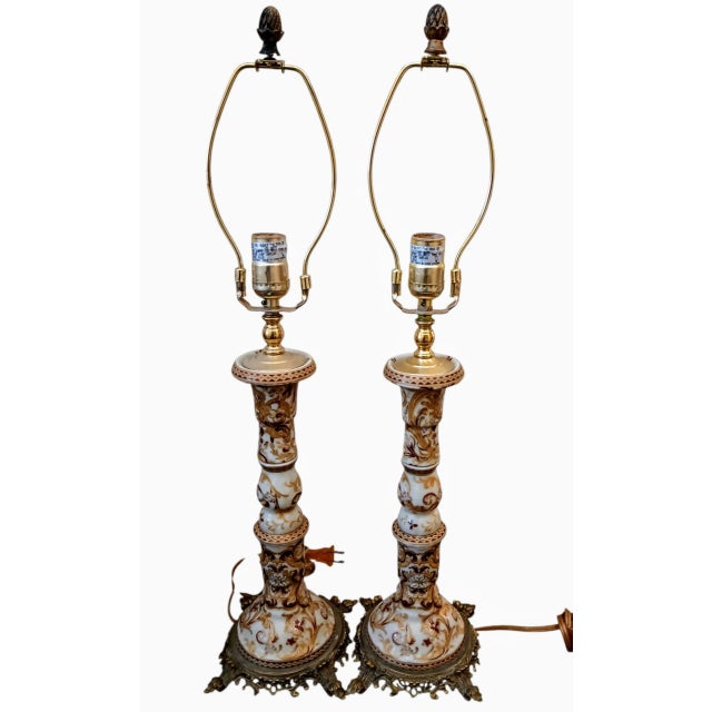 A Pair of Rare Vintage French Renaissance Rococo table lamps & Longwy-style Ceramic Urn The lamps feature ornate brass...