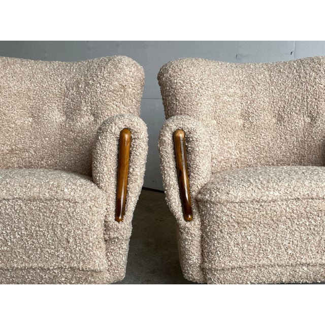 A rare and desirable pair of Danish Cabinetmaker lounge chairs from the 1940s — commanding examples of Scandinavian Modern...