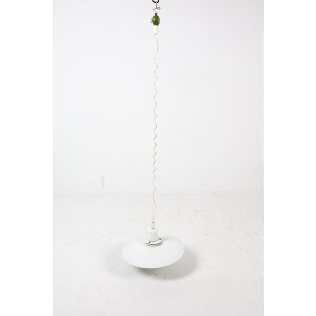 This is a vintage Top Lamper "Leto" pendant light, a classic example of Danish modern design from the 1960s to 1970s. The...