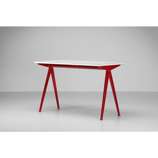 Rare model 512 Compas table designed by Jean Prouvé and manufactured by Ateliers Jean Prouvé in France, 1953. This...