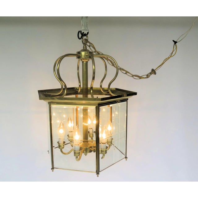 This unique Asian cage-style chandelier is topped off with 6 curving pieces of brass to form a stylish vintage crown. This...