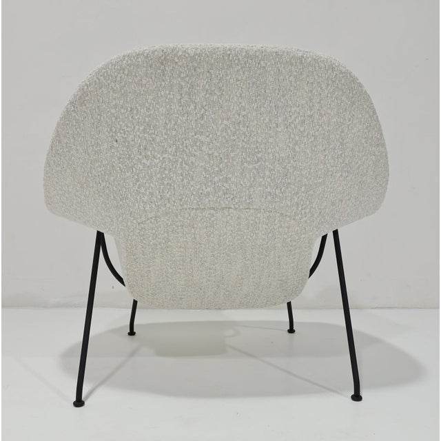 The iconic Eero Saarinen for Knoll Womb Chair, newly upholstered in an exquisite bouclé with black frame.