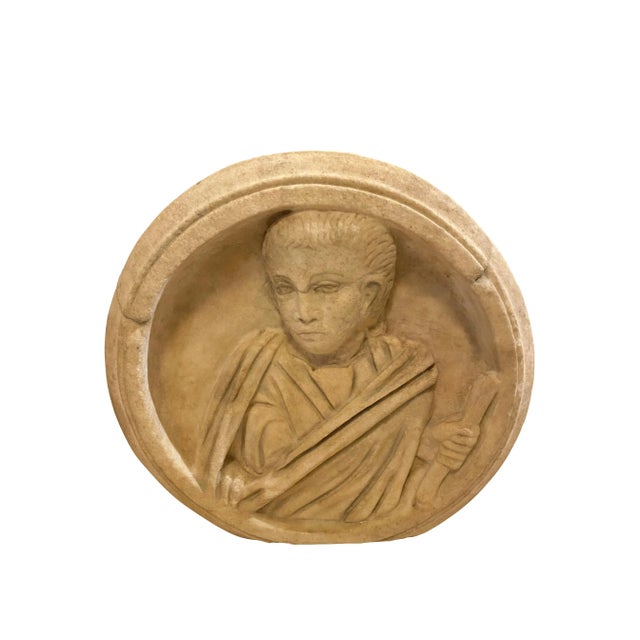 Depicting a robed man holding a scroll in a circular frame, the hairstyle recalls that Emperor Gallienus; rough technique...