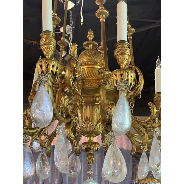 The 19th c. French Gilt Bronze and Rock Crystal Chandelier is a luxurious and elegant lighting fixture. This chandelier...