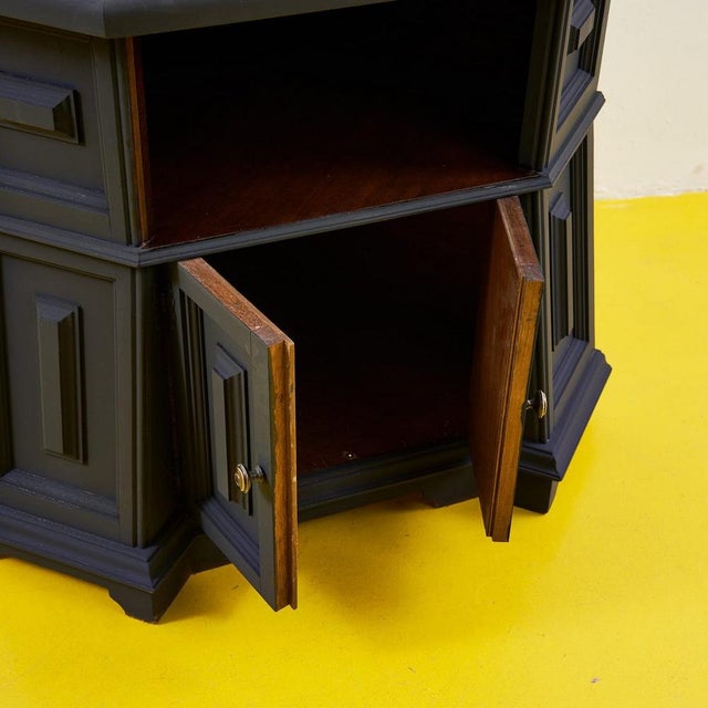 This elegant corner cabinet is a perfect fusion of functionality and contemporary style. Featuring a matte black finish...