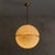 Designed in Italy during the 1970s, this pendant is composed of two acrylic hemispheres joined in quiet symmetry, an...