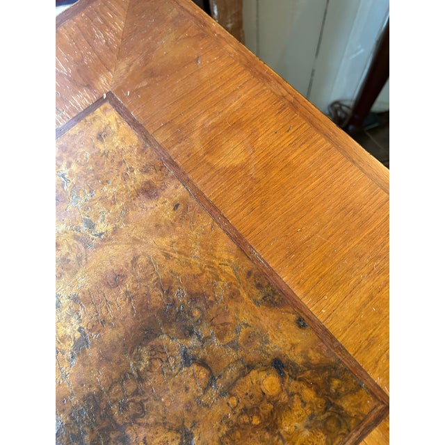 Great bones, alittle worn, vintage writing desk having beautiful grain Burl wood on top with inlay, on top of ebonized...