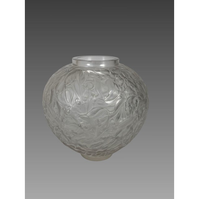René Lalique (1860-1940) "Gui" (Milk) Vase Molded, blown white glass vase with a motif of intertwined mistletoe branches...