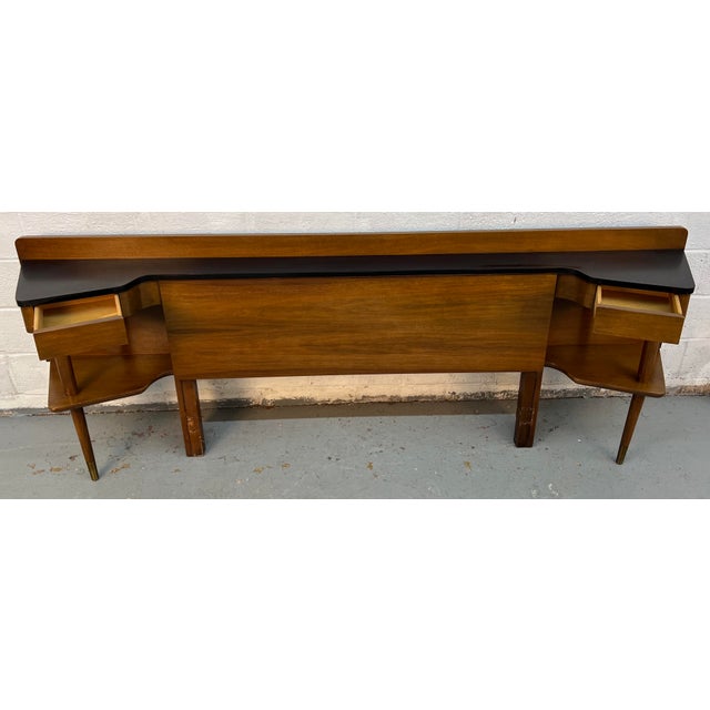 Elevate your bedroom with this iconic mid-century modern “Dania” bar bed headboard, designed by Merton Gershun for...