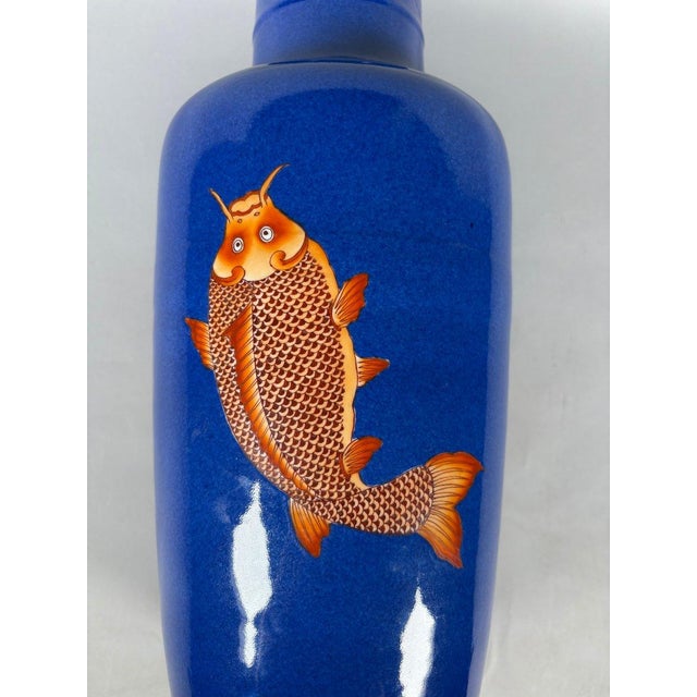 Blue CHINA, 19th century. Porcelain vase with a scroll decorated with carp on a powder blue background. For Sale - Image 8 of 9