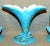 Fabulous three-vase garniture sent with mottled turquoise glaze and gold trim. The matching vases measure 9" x 3.5", the...